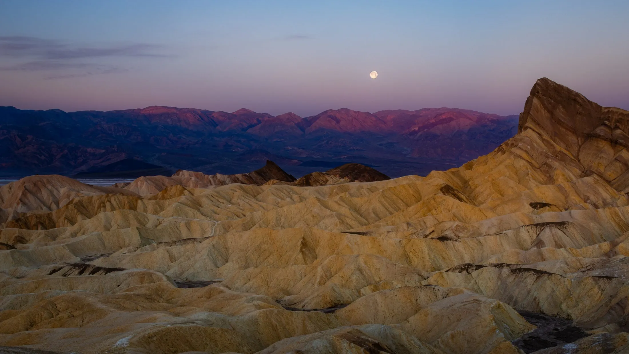 A full moon rising over the badlands of Zabriskie Point, Death Valley — fine art landscape print